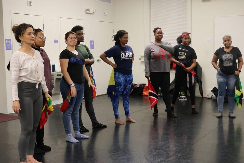 Participants watching Professor Jones go over the dance moves they’d learn that evening.