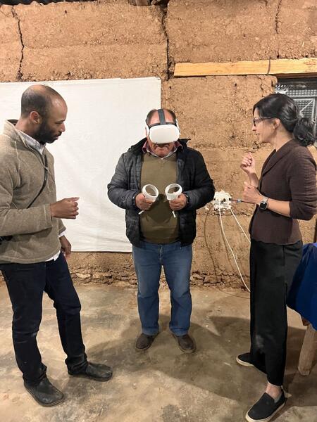 Testing out their VR prototype at a community meeting.