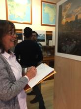 Professor Claudia Valeggia views each of the photographs in the exhibit. Professor Claudia Valeggia views each of the photographs in the exhibit.
